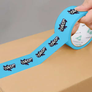 A roll of blue BOPP packaging tape featuring a logo design, partially applied to a cardboard box.