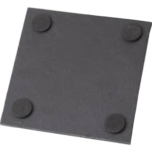 A square black slate coaster with rounded corners and four rubber feet on the underside.