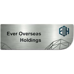A custom metal name badge in silver with geometric designs and a logo on the side.