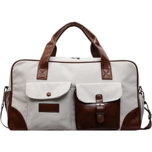 A vintage canvas duffle bag in cream and brown, featuring multiple pockets and sturdy handles. Logo present on the bag.