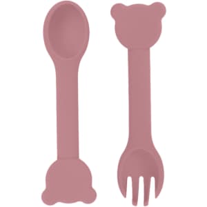 A bear-shaped silicone kids cutlery set in soft pink, featuring a spoon and fork with bear-shaped ends.