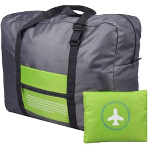 A grey and lime green compressed travel bag with a handle and a small pouch attached.