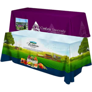 A 4-sided throw tablecloth in purple and blue featuring graphics of farmland and beverages, with a logo.