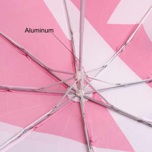 A lightweight umbrella featuring a wooden handle and a pink canopy with a geometric pattern. The frame is made of aluminium.