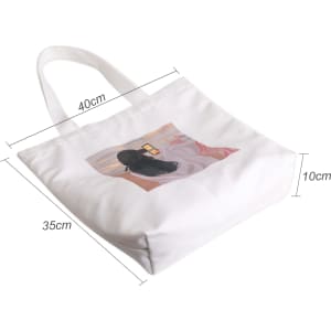 A white velvet tote bag featuring a full-colour design on both sides, measuring 40cm by 35cm by 10cm.