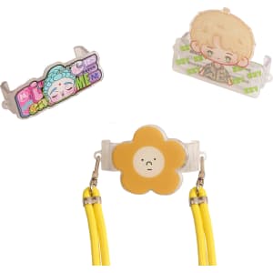 An adjustable phone lanyard with a yellow flower clip and two decorative attachments in various colours.