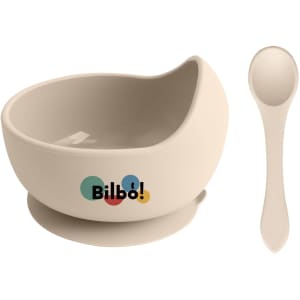 A beige silicone kids suction bowl with a matching spoon and a logo on the side.