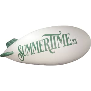 An inflatable blimp in white with green text featuring the word "SUMMERTIME" and a branding logo.