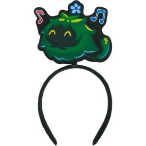 A custom felt headband featuring a green character with musical notes and flowers, set on a black band.