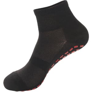 A pair of black children's gripper socks with a textured design and red non-slip grip on the sole.