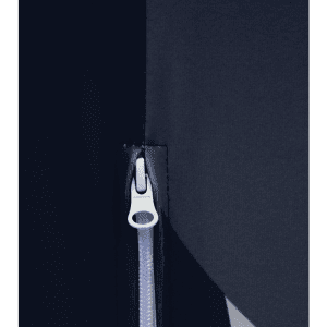 A close-up of a zip on a dark fabric, featuring a silver pull tab against a contrasting background.