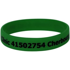 A green silicone wristband featuring a logo and printed text in black.