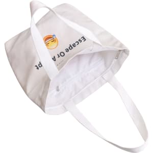 A white velvet tote bag featuring a colourful design on both sides. It has sturdy white handles and an interior zip pocket.