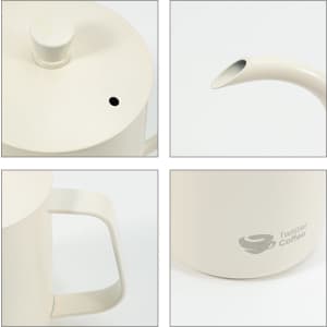 A stainless steel pour over kettle in cream colour, featuring a spout, handle, and a logo on the body.