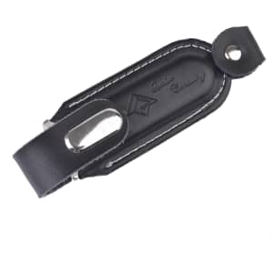 A black leather Venus Flash Drive with a metal casing and a snap closure, featuring stitching details and a logo.