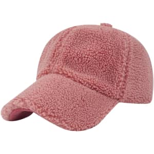 A lamb fur baseball cap in pink, featuring a soft, textured surface and a curved brim.