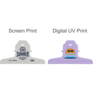Two metal binder clips in white and purple featuring prints of "Summer Holidays" designs. Both clips have logos.