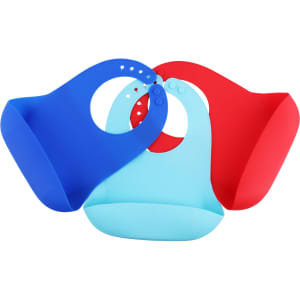 Three silicone bibs in blue, light blue, and red, featuring snap closures. The bibs have a logo displayed on them.