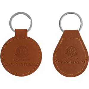 A brown PU leather keyring featuring a circular and a teardrop shape, both including a metal keyring attachment.