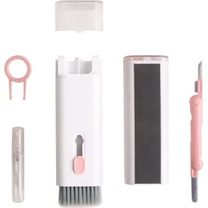 A 7 in 1 cleaning kit featuring white and pink components, including a brush, scraper, spray bottle, and two additional tools.