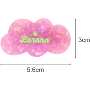 A pink iridescent hair clip shaped like a cloud with a logo, measuring 5.6cm by 3cm.