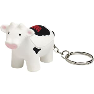 A cow-shaped stress reliever in white and black, attached to a metal keyring.