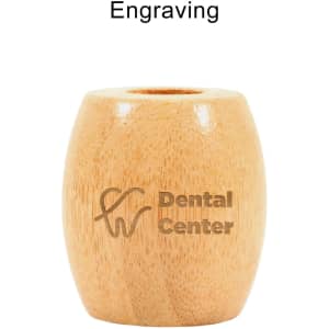 A bamboo toothbrush stand in a light wood finish with a circular opening at the top and a branding logo.