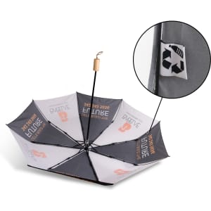 A triple folding RPET umbrella in black and grey, featuring a logo and a recycling symbol on one panel.