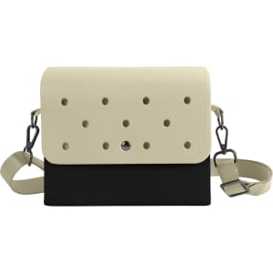 A two-tone EVA briefcase featuring a cream top with holes and a black bottom, complete with a shoulder strap.