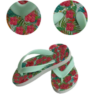 Rubber thongs in mint green with a vibrant floral print featuring pink flowers and tropical leaves.