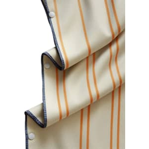 A beige hooded change towel with orange vertical stripes and snap fasteners along the edge.