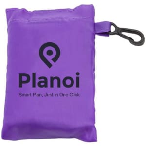 A purple foldaway shopping bag with a clip, compactly stored in a small pouch featuring a logo.