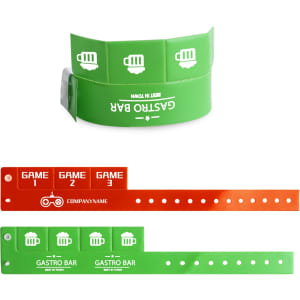 A green and orange tabbed disposable PVC wristband with circular cutouts and a logo, designed for events.