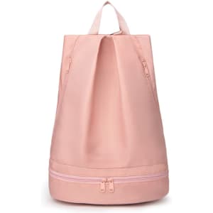 A pink backpack featuring a separate bottom compartment and a handle for easy carrying, with a logo.
