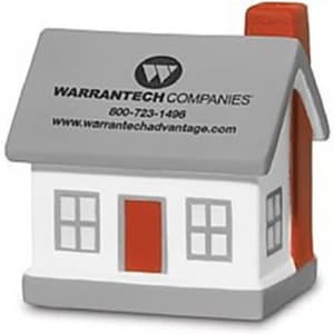 A house-shaped stress reliever in grey and white with an orange door and chimney, featuring a logo.