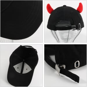 A black baseball cap featuring red devil horns and a silver adjustable clasp at the back. It has a logo on the side.