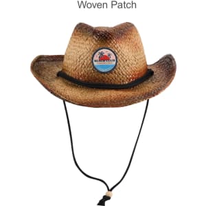 A cowboy straw hat with a woven patch, featuring a neutral brown colour and a decorative black string.