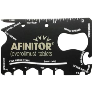 A black card-sized multi-tool with various functions, including a bottle opener and ruler, featuring a logo.