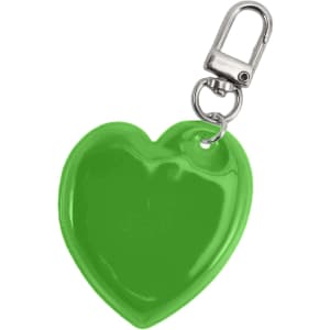 A green heart-shaped reflective keychain with a metal clip attachment. It has a shiny, smooth surface.