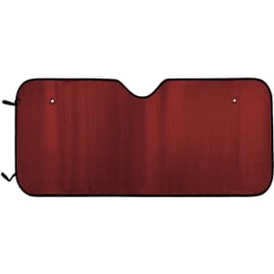 A red bubble aluminum car sunshade with a black border and holes for securing it in place.