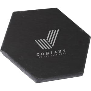A hexagonal slate coaster in charcoal black with a logo printed on the surface.