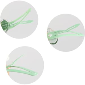 A green hair clip featuring a colourful design, shown in three circular close-up views. It has a logo visible.