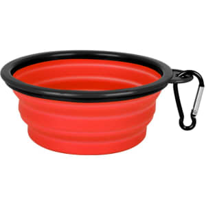 A red collapsible silicon bowl with a black rim and a carabiner clip for easy attachment.