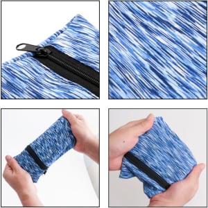 A mini wearable wallet in a blue patterned fabric, featuring a zip closure and easy to fold design.