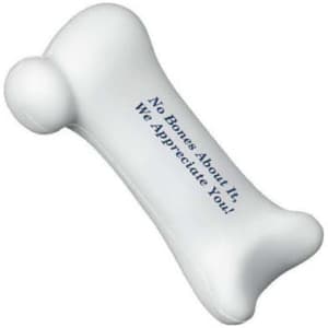 A white stress reliever shaped like a human bone with a rounded end. It features text in dark blue.