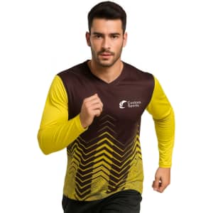 A man in a brown and yellow long-sleeve V-neck sports shirt with a logo, featuring a chevron pattern.