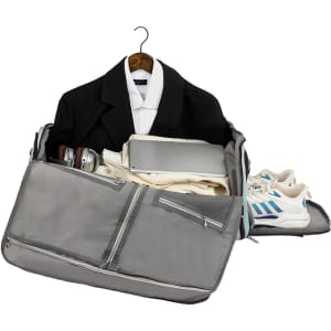 A grey convertible backpack duffel garment bag, partially open, displaying clothing, shoes, and various items inside.