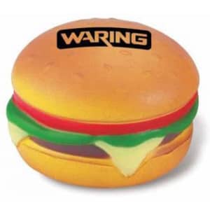 A hamburger-shaped stress reliever in yellow and brown, with red and green detailing, featuring a logo on top.