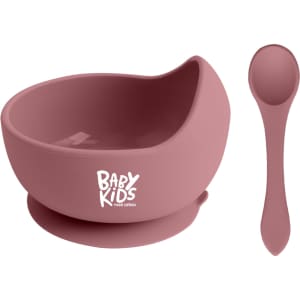 A silicone kids suction bowl in pink with a matching spoon. The bowl features a logo on the front.