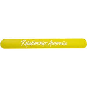 A yellow silicone slap band with a logo, featuring a smooth, flexible design ideal for promotional events.